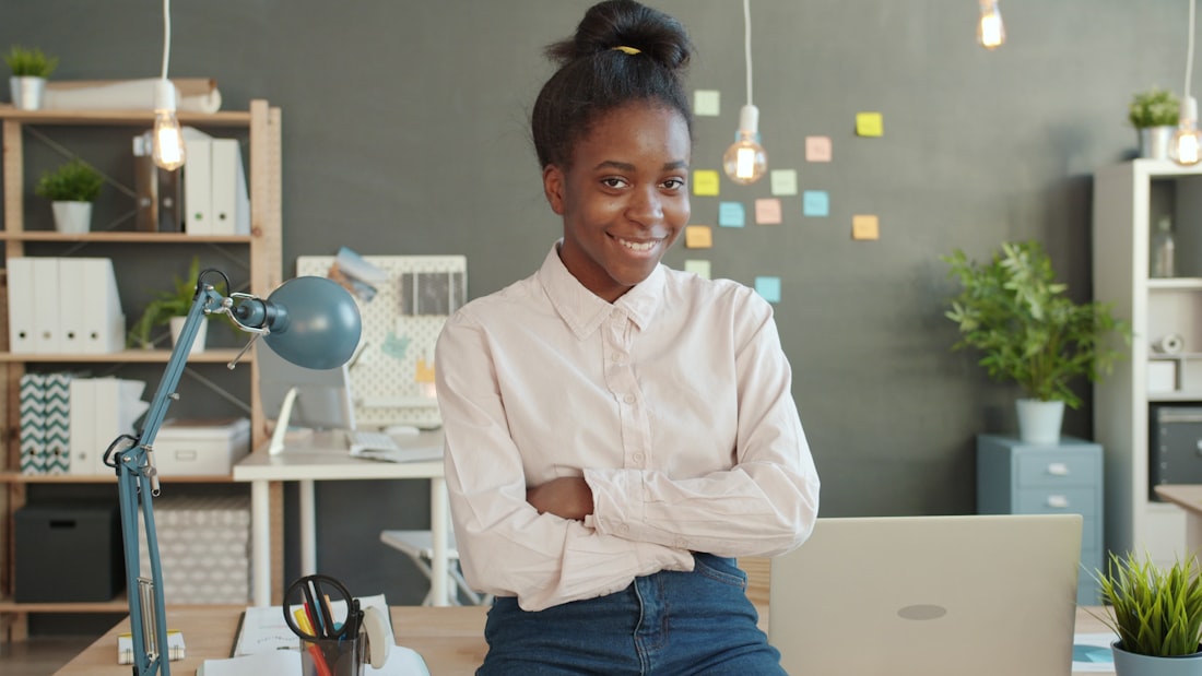 A young professional running her business from a laptop
